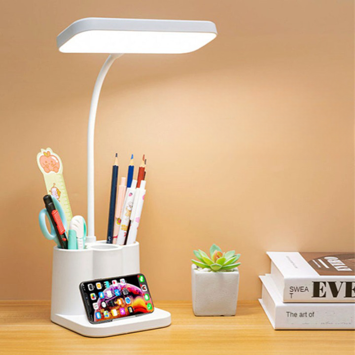Lampe de table LED avec rangement pour stylo sur fond beige
